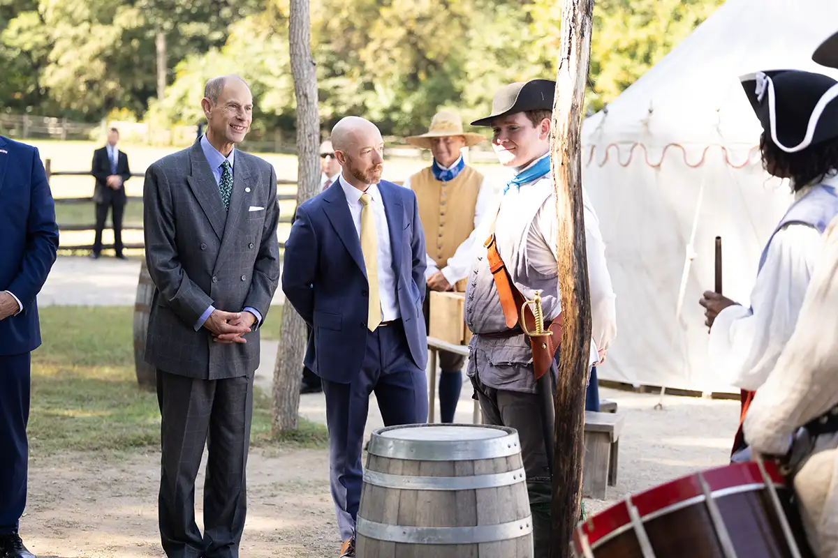Prince Edward in front of Revolutionary War reenactment site at Mount Vernon