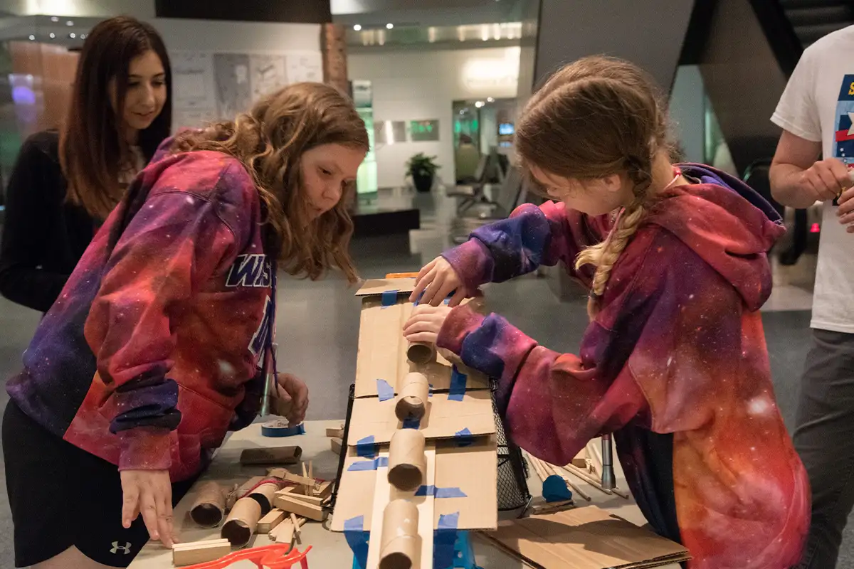 kids do a craft at a Smithsonian Sleepovers event