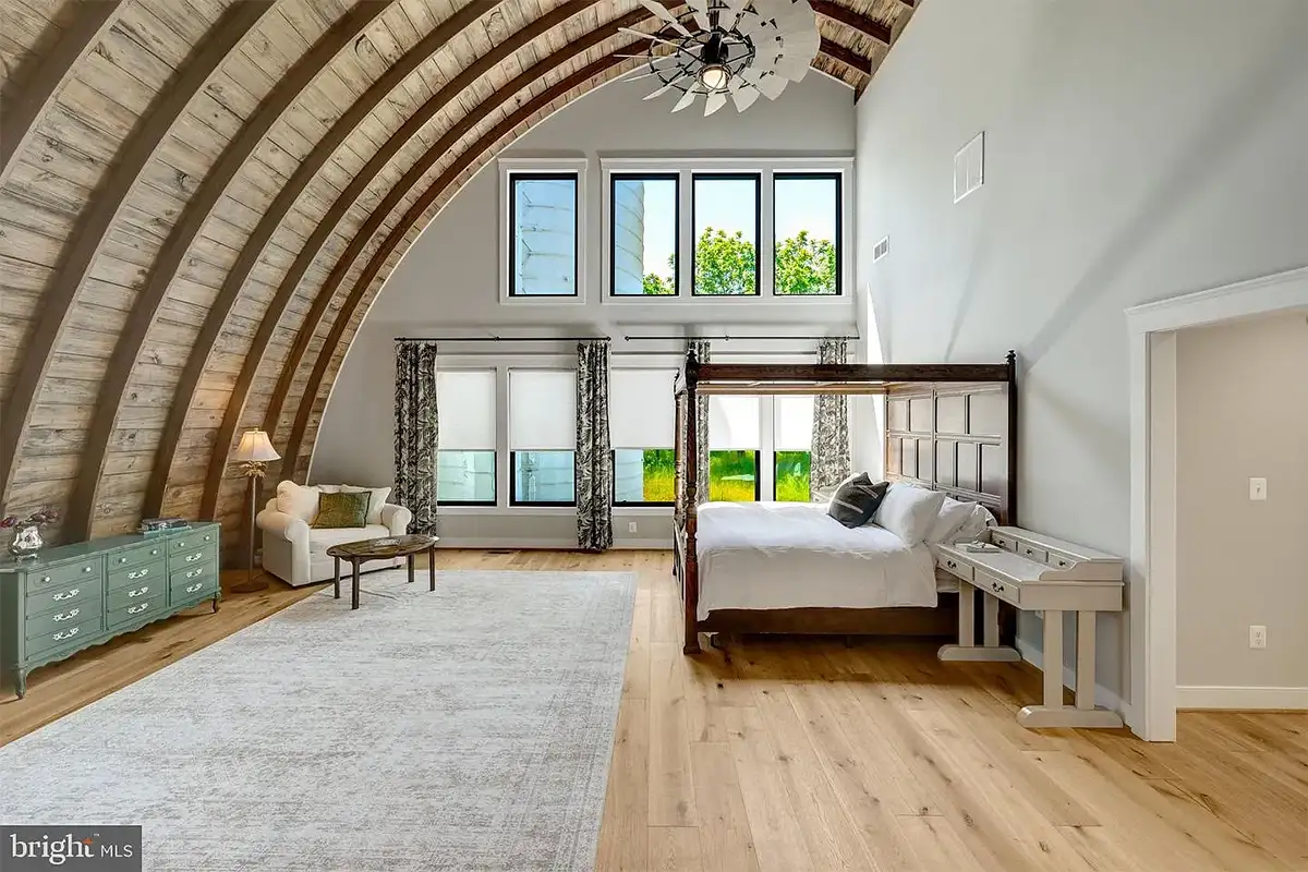 Primary bedroom with arched wood ceiling