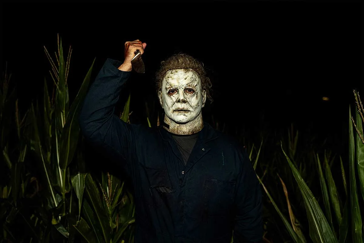 person in Michael Myers mask with knife