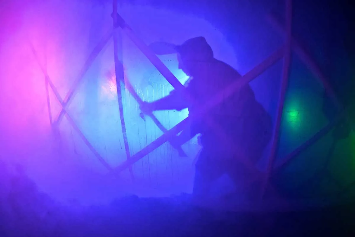 silhouette of person dressed as the bunnyman with an axe