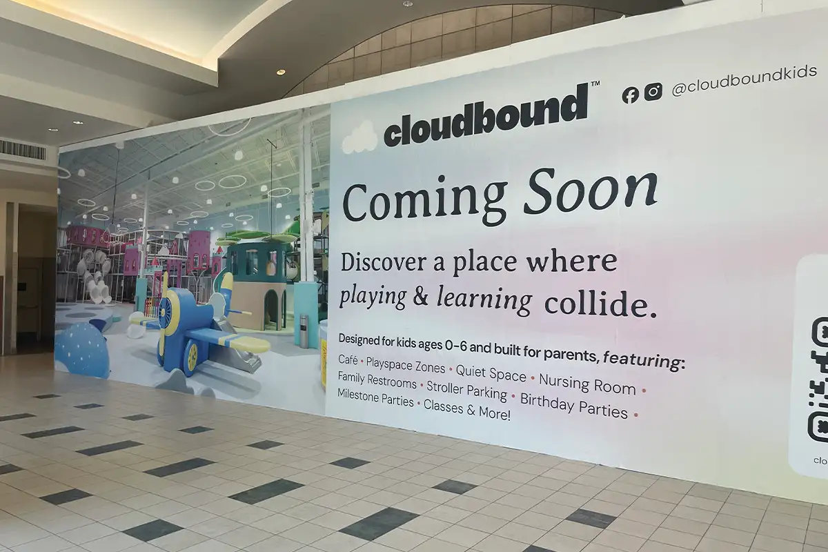 Image of huge coming soon sign in Dulles Town Center presenting the upcoming cloudbound kid's playground