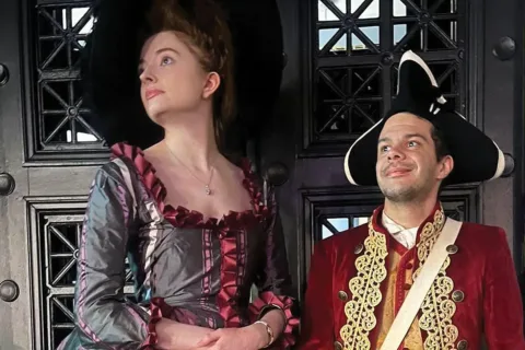 two actors dress in colonial attire