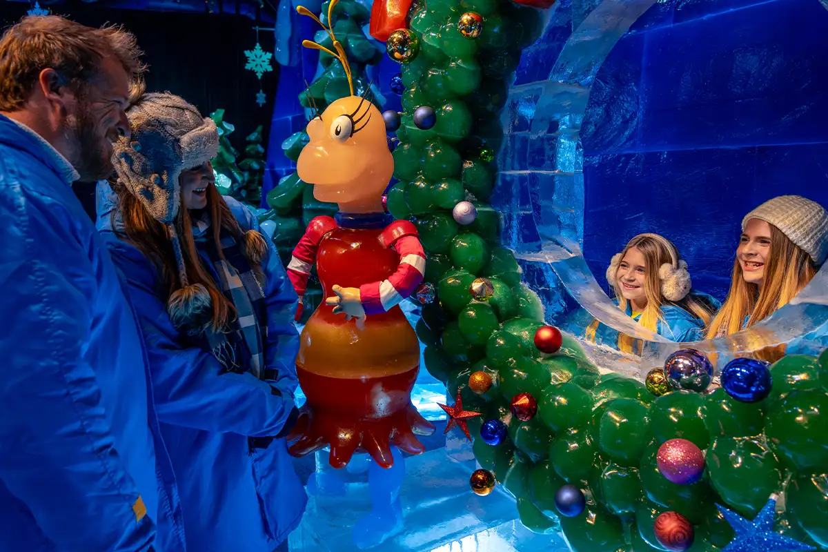 a family at the Gaylord Ice display