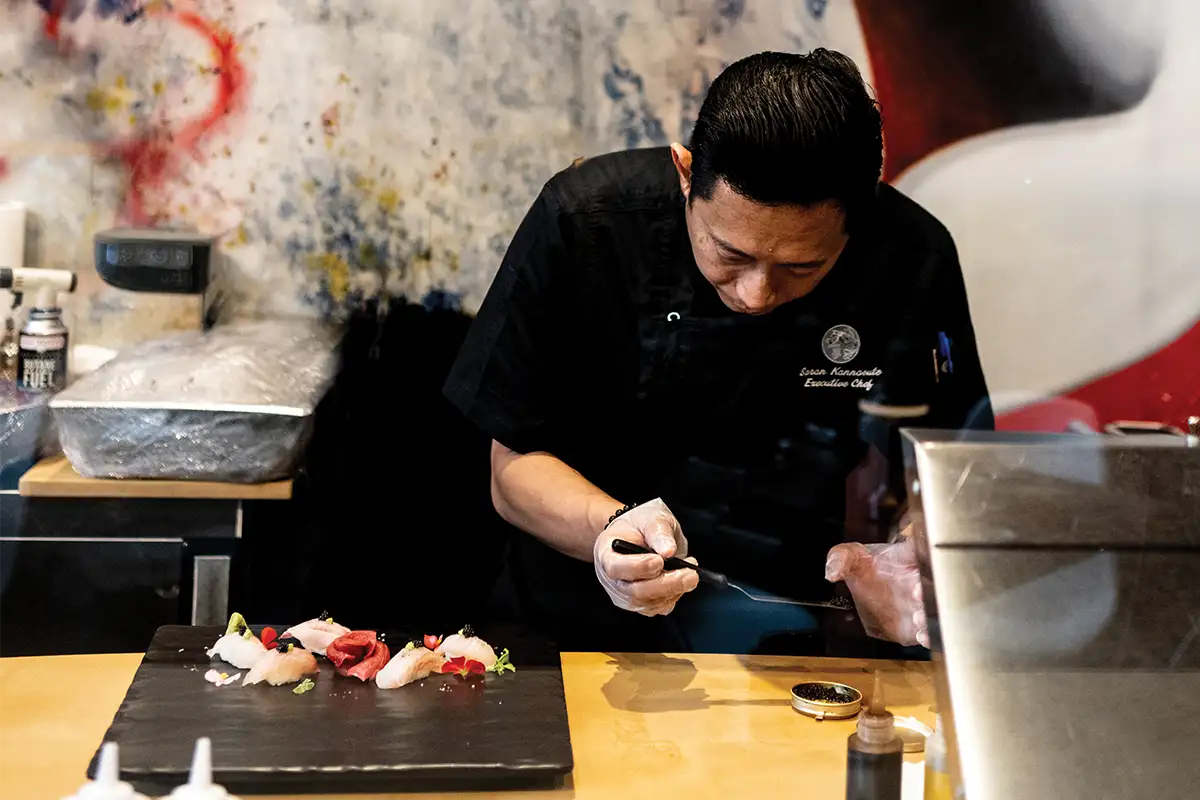 chef preparing sushi dish